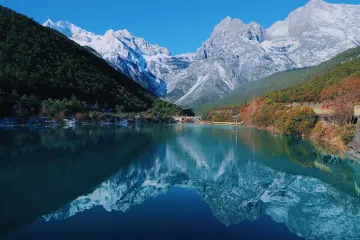 Crystal-blue waters of Blue Moon Valley nestled beneath Jade Dragon Snow Mountain, a UNESCO reserve in Lijiang, Yunnan.